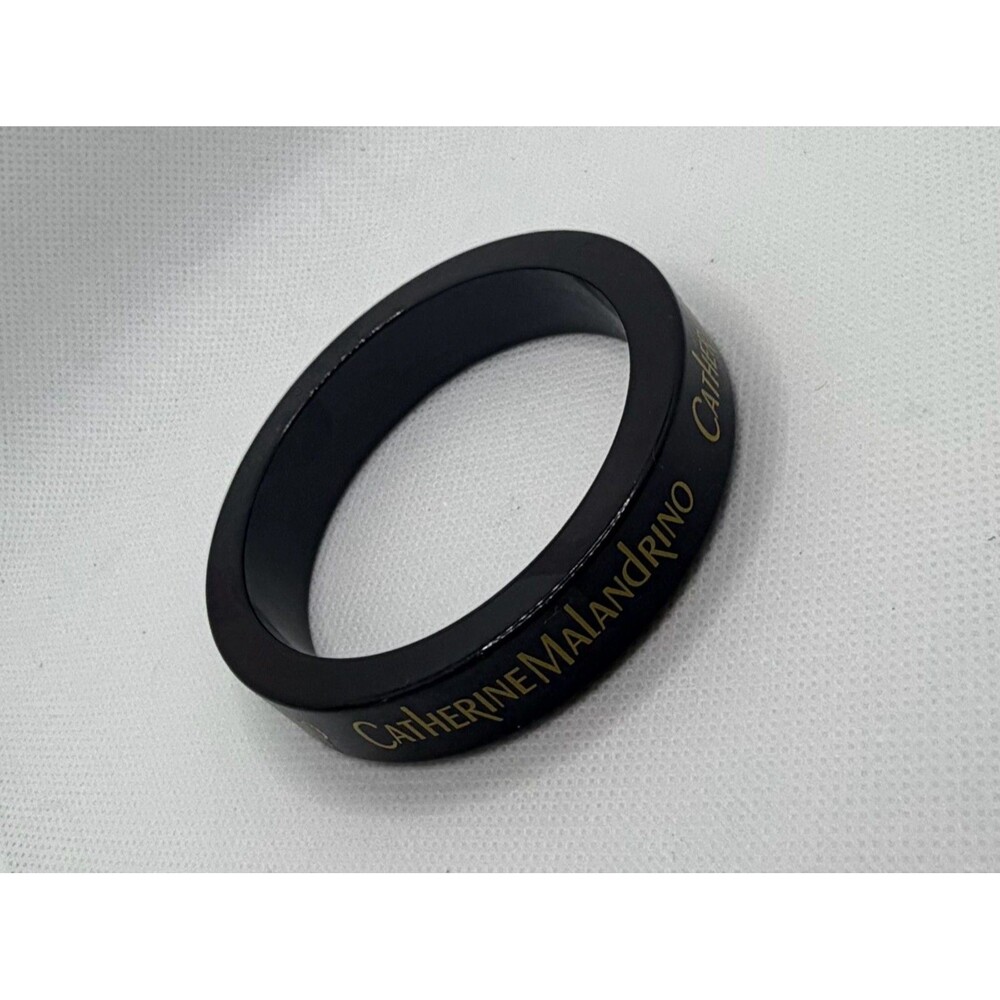 Catherine Malandrino Black Resin Bangle Bracelet with Gold Lettering
